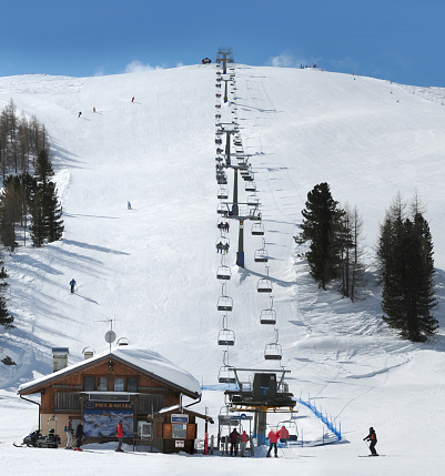 Cortina d'Ampezzo, February 2009: Lifts and skiers near the Falzarego pass in the Cortina d'Ampezzo dolomites. Veneto, Italy.