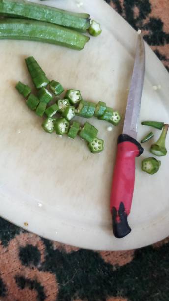 istock Ladiesfinger sections and cutting.. fresh veggies 1295932667