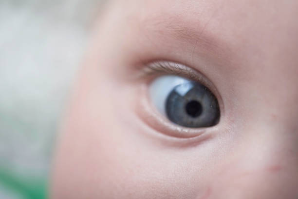 istock cute little baby playing with hands and smiling 1295932716