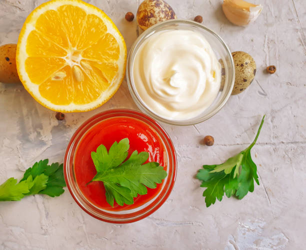istock ketchup, mayonnaise,  eggs on a concrete background 1295932881