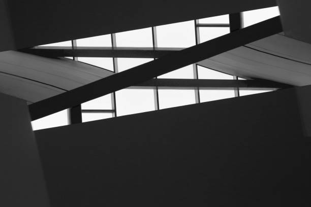 istock Unreal architecture fragment. Computer graphic image of architectural surfaces. Stairs and windows. Abstract black and white interior background with geometric shapes. 1295935713