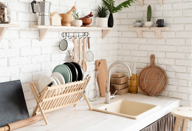 istock Rustic kitchen interior with white brick wall and white wooden shelves 1295936439