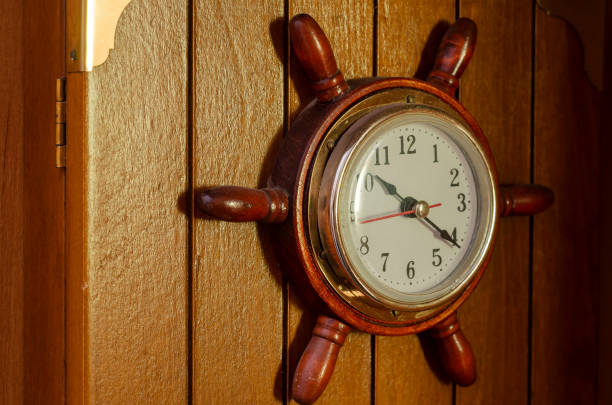 istock Wall clock in the shape of naval helm. 1295936687