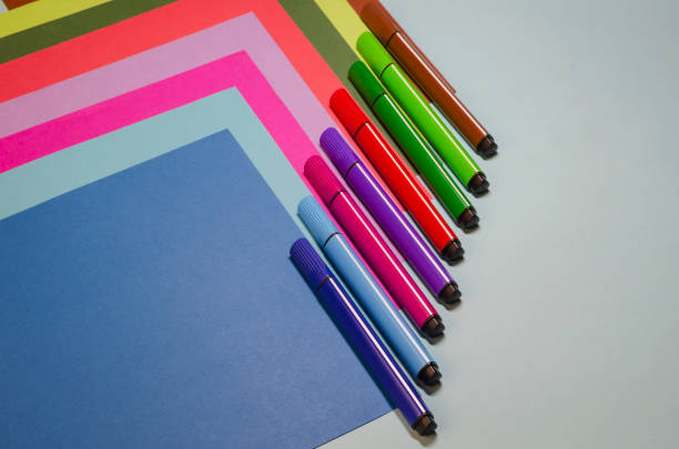 istock Creative geometric composition with colorful felt-tip pens and colored paper. 1295936768