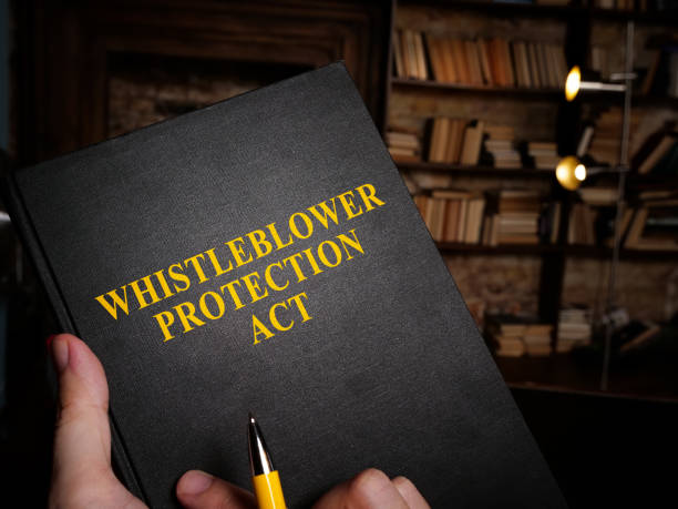 istock Whistleblower protection act book at the library. 1295937937