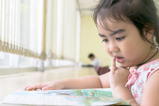 istock The children are reading books in the library. 1295938340