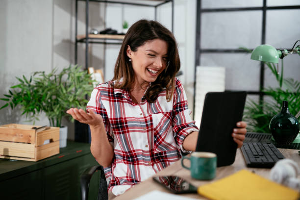istock Businesswoman is having a video call on tablet. 1295938464
