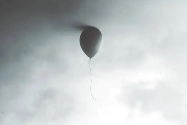 Photo of illustration of balloon flying at the end of the sky, surreal minimal concept