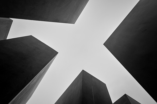 Low angle view of the Holocaust memorial monument stone blocks silhouette, Berlin, Germany.