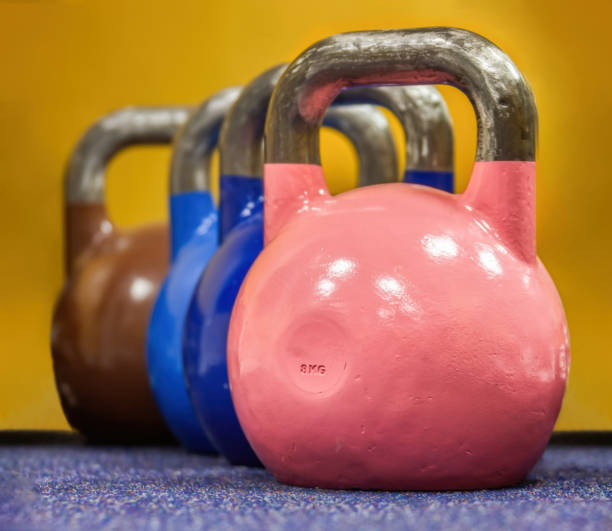 istock kettlebell weights parked on the floor in the gym 1295940851