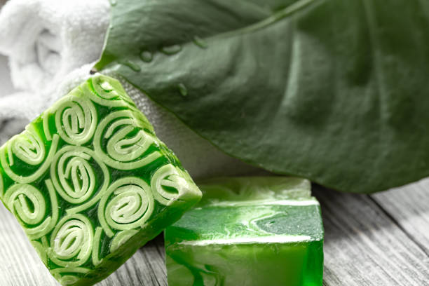 istock Spa composition with green handmade soap close up. 1295944352
