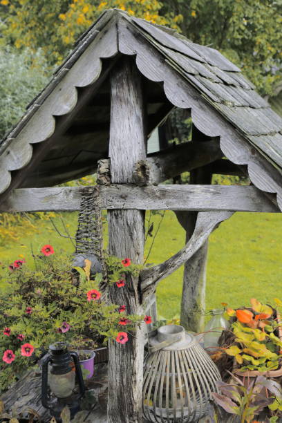 istock Weathered wishing well in garden 1295945469
