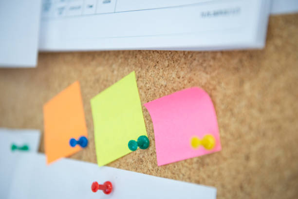istock colorful note papers, cork board for home, school and workplace. 1295946689