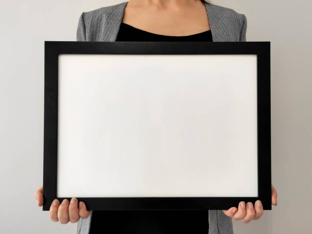 istock Woman holding a signboard with a hollow 1295947021