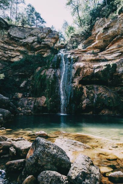 istock landscape with a pool with waterfall in a place of spain 1295947717
