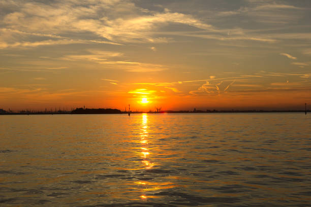 istock Sunset over the ocean in Venice, Italy 1295947838