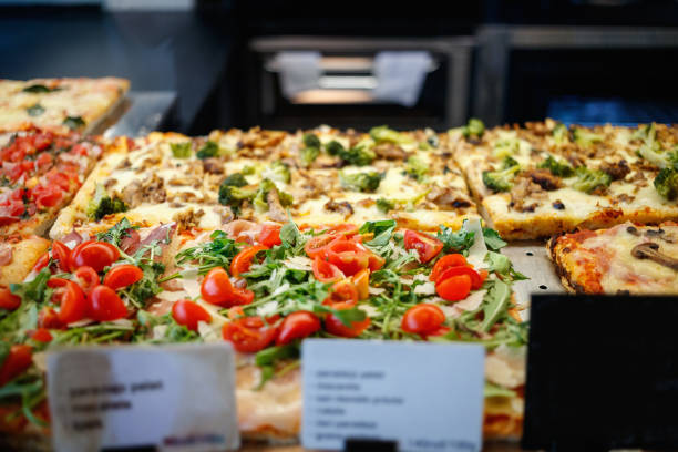 istock Pizza al taglio in retail glass showcase 1295952255
