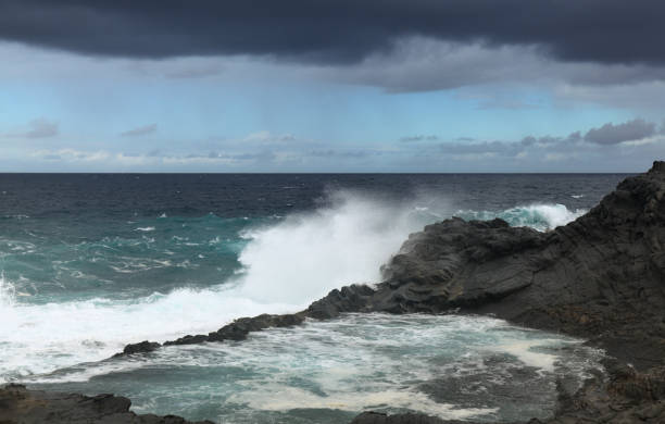 istock Gran Canaria, north coast, Puertillo de Banaderos area, powerful ocean waves brought by winter wind storm Filomena breaking along the shore 1295952912