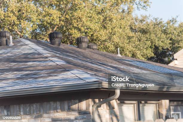 Snow Melting On Roof Shingles Of Suburban Residential House In Coppell Texas Usa Stock Photo - Download Image Now