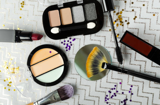 istock Top view of accessories for makeup and decorative cosmetics on the grey surface 1295955162