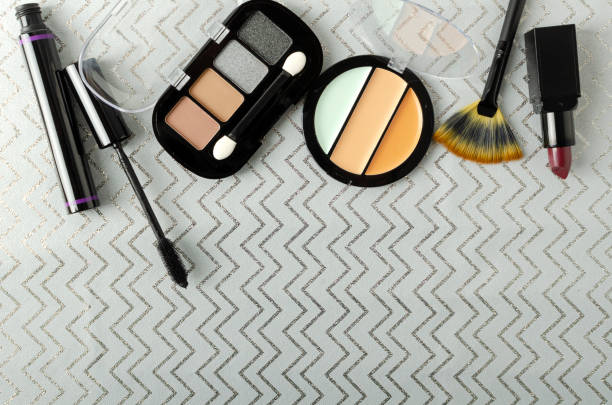 istock Top view of decorative cosmetica on the grey wrapping paper.Empty space 1295955225