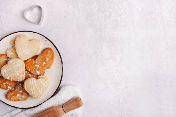 Baked cookies-hearts on the kitchen table with copy space