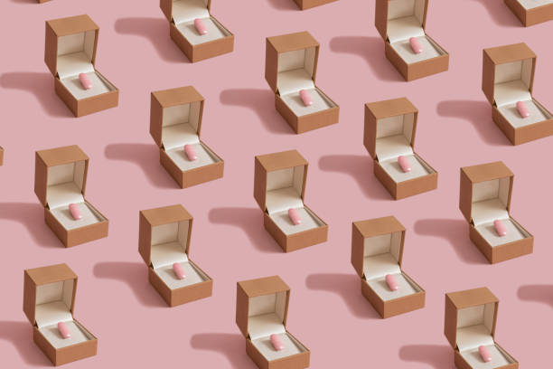 istock Creative pastel composition made of pink pill and engagement ring box. Minimal Valentine's Day pattern. 1295958324