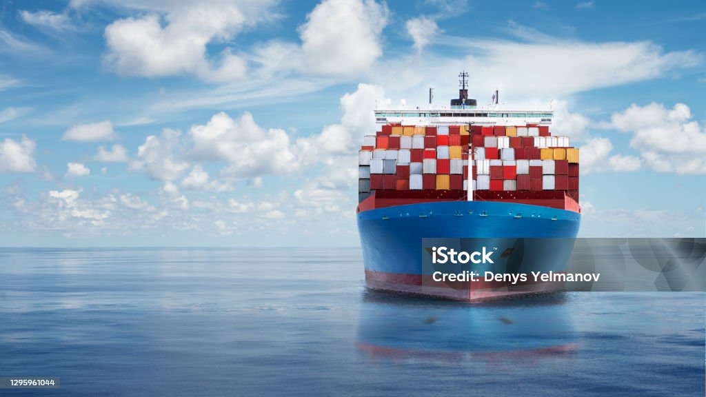 Front view from bow of a large blue shipping container ship. Front view from bow of a large blue shipping container ship in the ocean. Ship Stock Photo