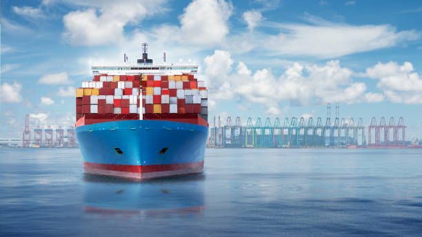 istock Front view from bow of a large blue shipping container ship. 1295961049