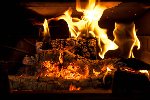 istock Logs burning in the fire of a fireplace with embers 1295961125