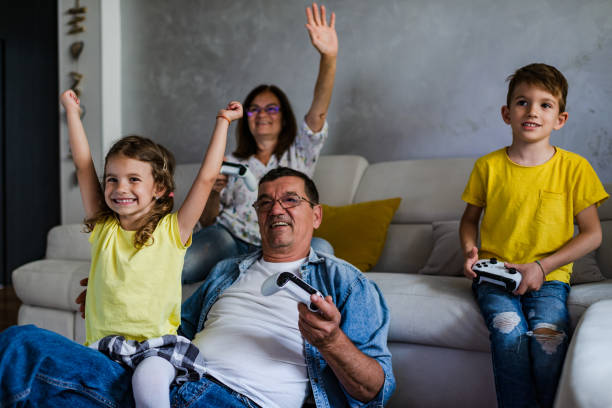 istock Family playing video games 1295963348