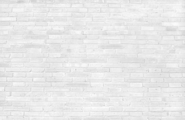 istock White grey brick wall texture with vintage style pattern for background and desing art work. 1295963400