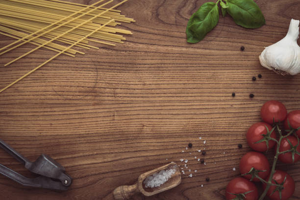 istock A border frame made of fresh pasta ingredients on a wooden surface 1295963431