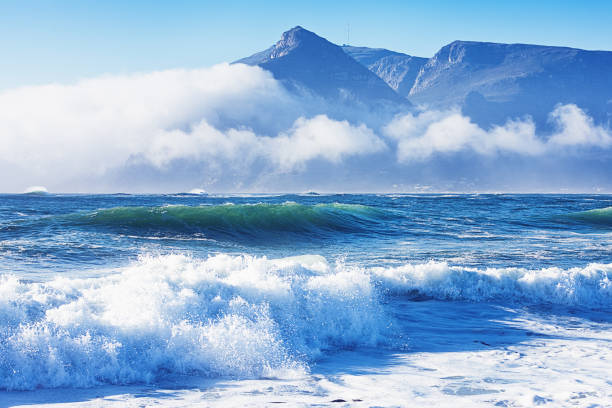 Magical, ethereal coastal scene with sea, cloud and light View of the sea on a beautiful sea shore. kommetjie stock pictures, royalty-free photos & images