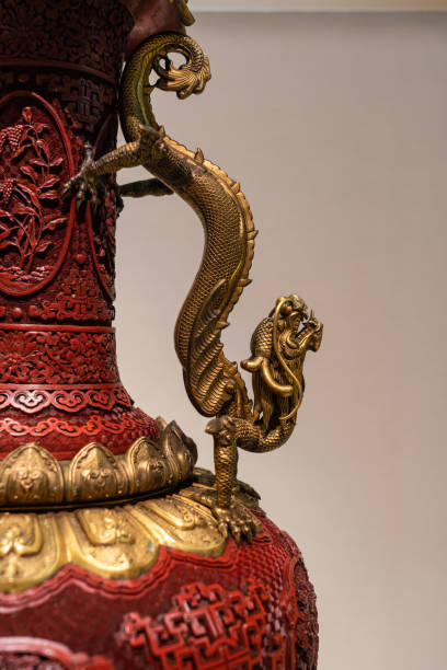 istock Ancient China Carved Lacquer Vase Golden Dragon Handle Close-up 1295964803