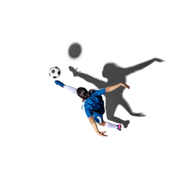 Kicking the ball. Young man soccer football player isolated over white background with shadow. Top view. Concept of action, motion, youth, sport, healthy lifestyle. Copy space for ad, design.