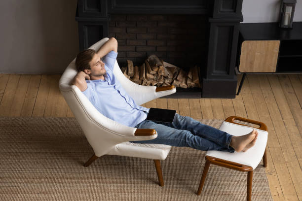 istock Calm Caucasian man relax in chair taking nap 1295970384