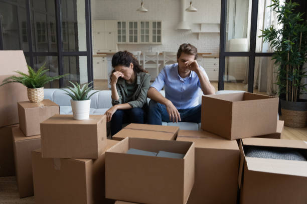 istock Unhappy couple have problems on moving day 1295970390