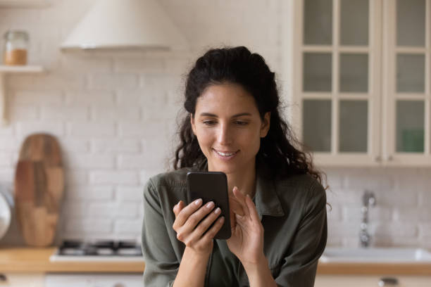 istock Happy woman browse internet on modern smartphone 1295970453