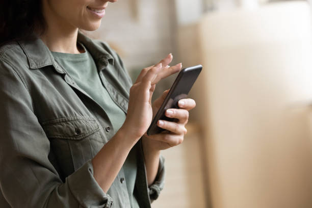 istock Close up of woman use smartphone browsing internet 1295970456