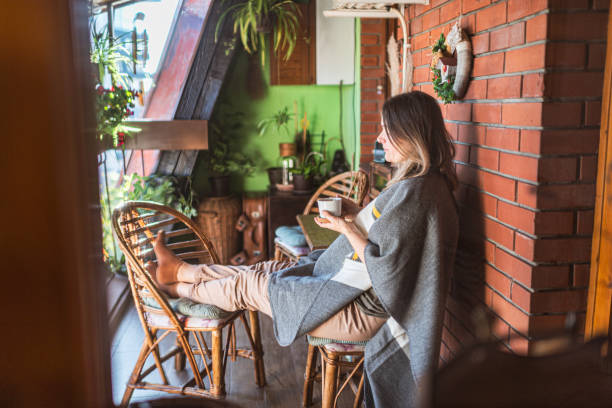 istock Woman enjoying on a terrace 1295972617