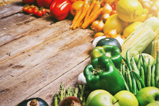 Abundant variety of fresh fruit and vegetables on display at a rustic farmer's market