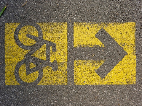 bicycle path marking on the street with pictogram of a bike