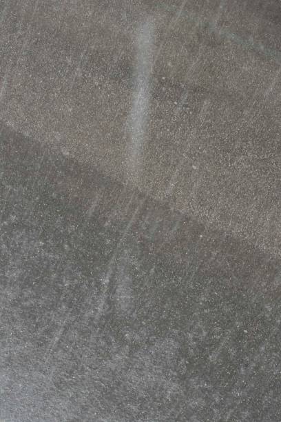 istock heavy rain and rain puddles 1295977028
