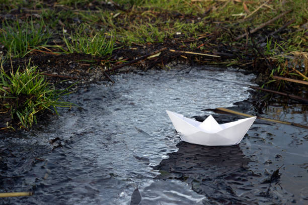 istock paper boat on the coast with ice 1295978557