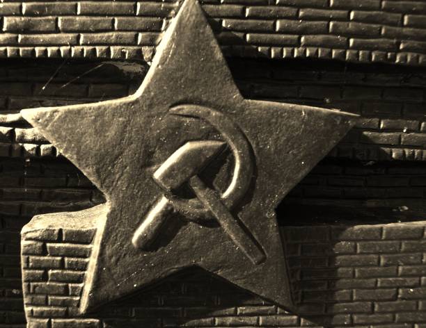 istock Soviet star on the wall in Berlin-Lichtenberg 1295978881