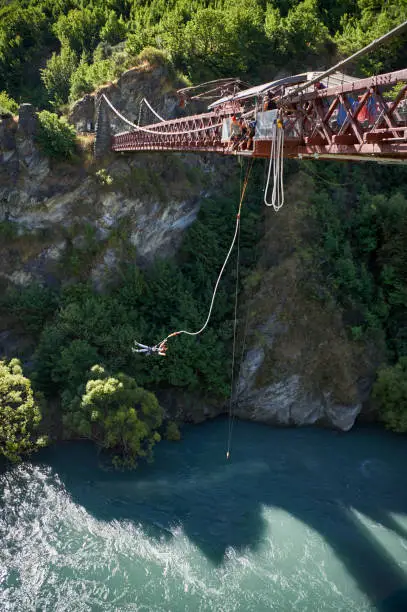 Bungee jump from bridge over river
