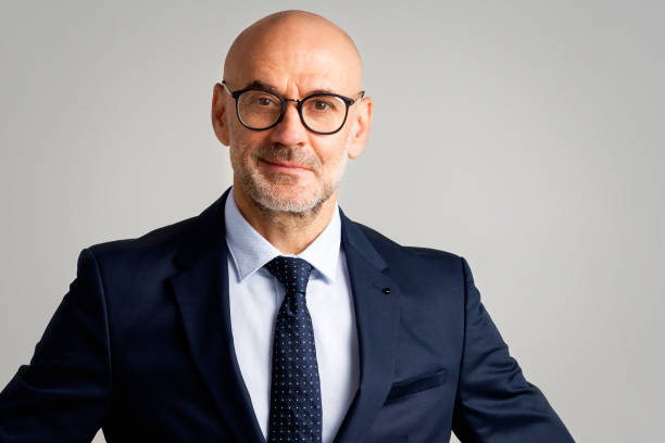 istock Executive businessman studio portrait at isolated background 1295981468
