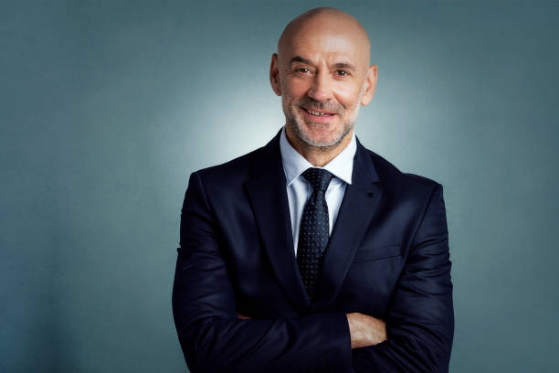 istock Executive businessman studio portrait at isolated background 1295981473