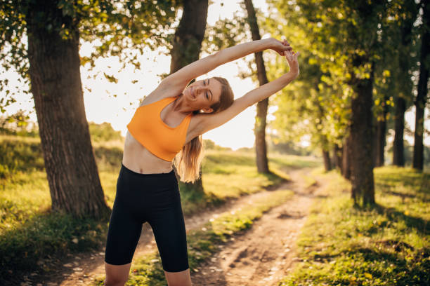 istock Fit woman exercising alone in nature 1295981841